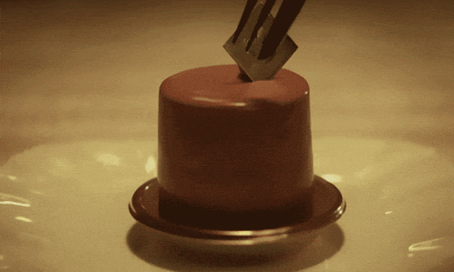 a piece of chocolate cake with a fork sticking out of it