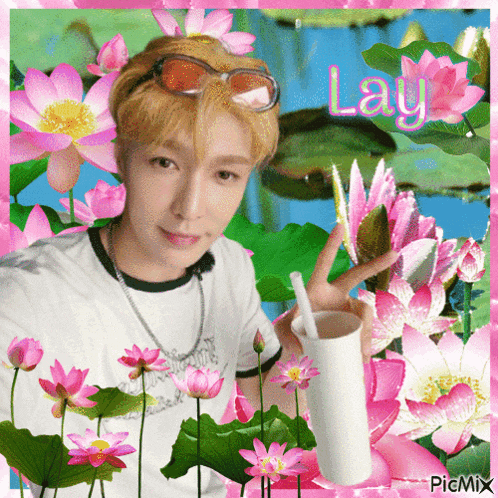 a picture of a man surrounded by pink flowers with the name lay written in pink