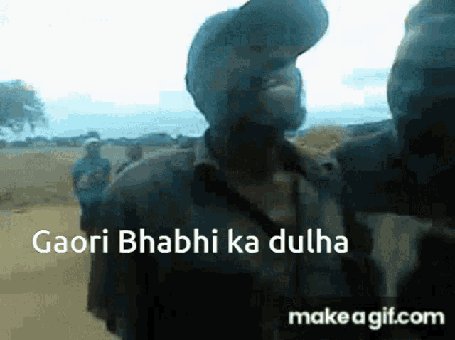 a man wearing a baseball cap is talking to another man with the words gaori bhabhi ka dulha written on the bottom