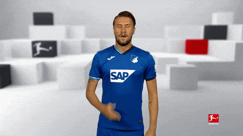 a man wearing a blue shirt with the word sap on the front