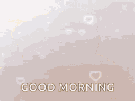 a teddy bear is holding a red heart and says `` good morning '' .