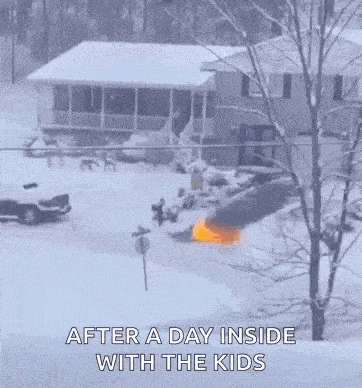 a house is covered in snow and a car is stuck in the snow in front of it .
