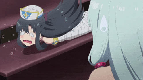 a girl in a nurse 's hat is laying on the ground