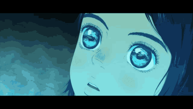 a close up of a person 's eyes with a blue background