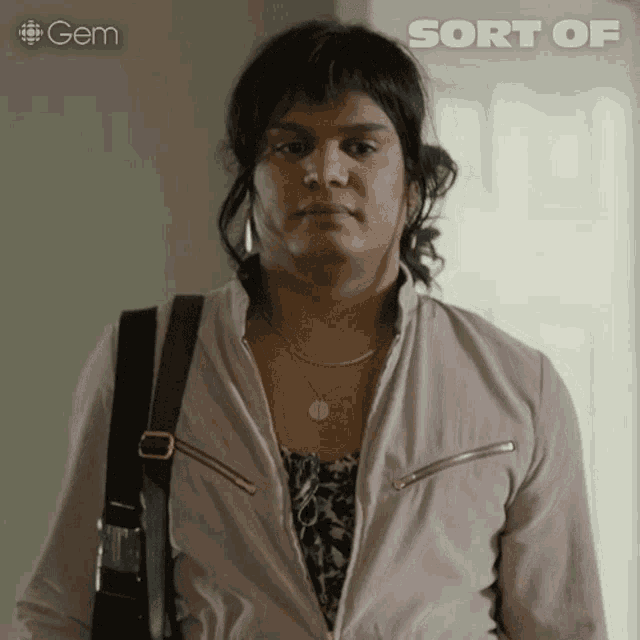 a woman with a purse looks at the camera with the words sort of written above her