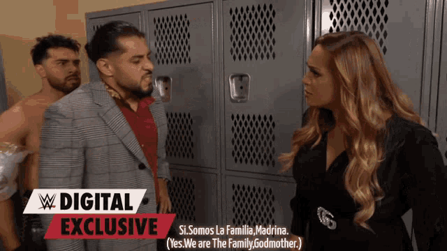 two men and a woman are standing in front of lockers with a digital exclusive sign