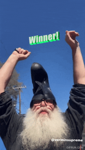 a man with a beard wearing a helmet with the word winner above him