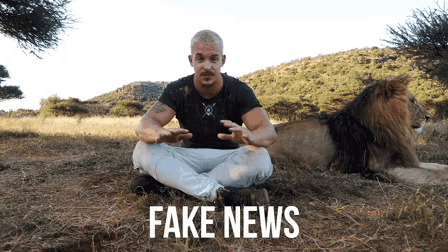 a man is sitting next to a lion with fake news written on the bottom