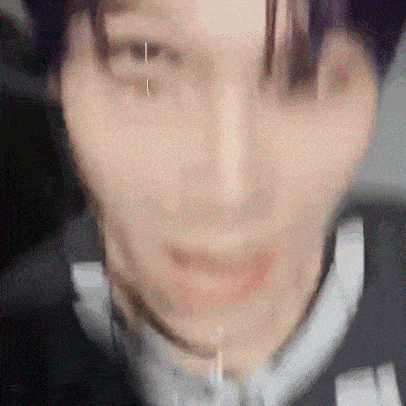 a close up of a person 's face with a blurred background