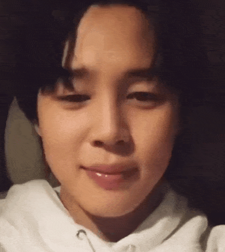a close up of a person 's face with a smile on it .
