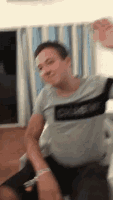 a blurry picture of a man wearing a shirt that says calvin klein