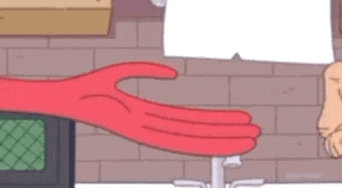 a man is putting a red glove on another man 's hand in a cartoon .