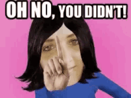 a woman is covering her nose with her hand and says oh no you didn 't