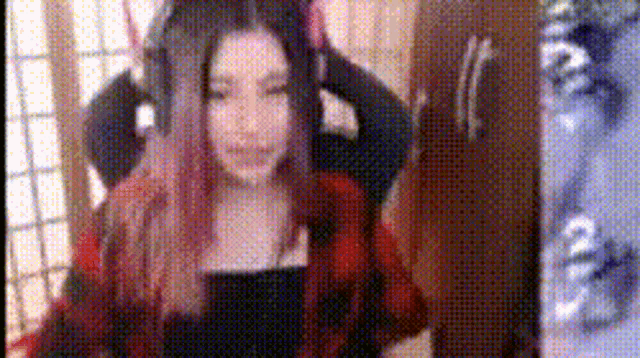 a woman wearing headphones is sitting in a chair