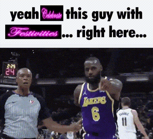 a basketball player in a lakers jersey shakes hands with a referee during a game