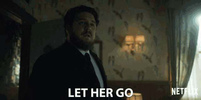 a man in a suit and tie says let her go in a netflix ad