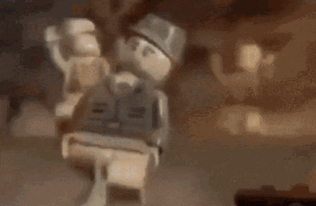 a blurred image of a lego figure standing in front of a crowd