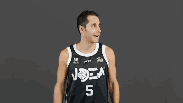 a man wearing a joea jersey number 5