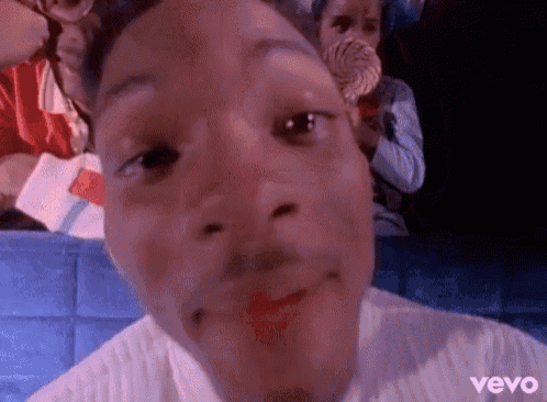 a close up of a person 's face with the word vevo on the bottom right corner .