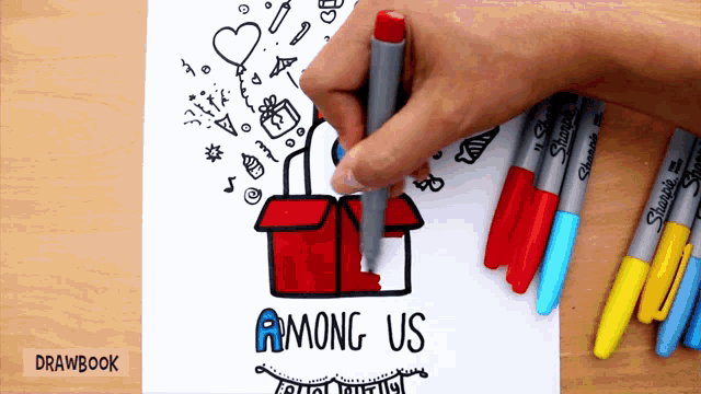 among us is written on a piece of paper next to markers