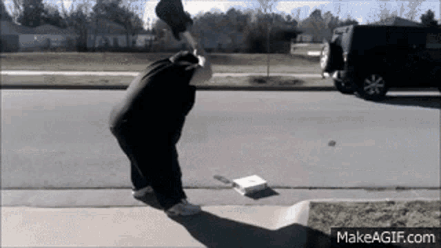 a man is throwing a pizza box in the air