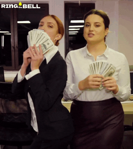 two women holding stacks of money with ring the bell written on the bottom