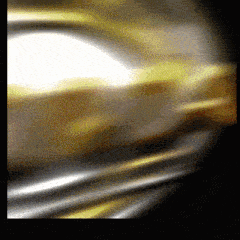 a blurred image of a gold and silver colored background