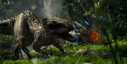 a large dinosaur is walking through a lush green field .