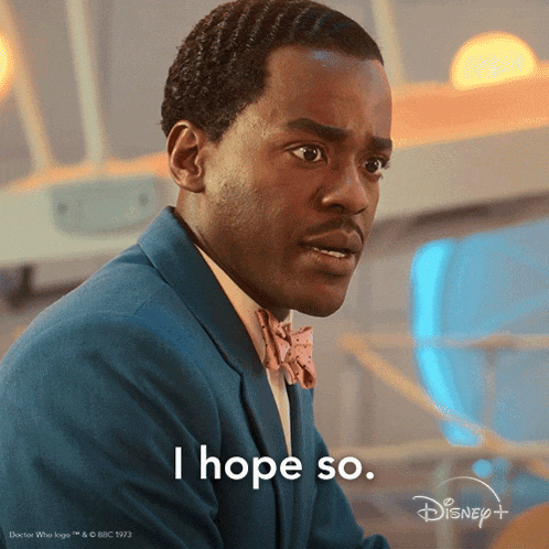 a man in a suit and bow tie says " i hope so " in white letters