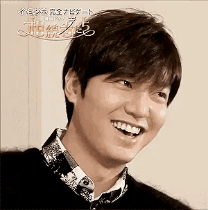 a close up of a man 's face with a smile on it