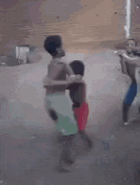a group of people are dancing in a room with a blurred background .