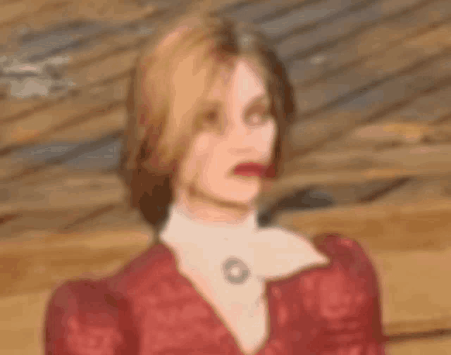 a blurry picture of a woman wearing a red dress
