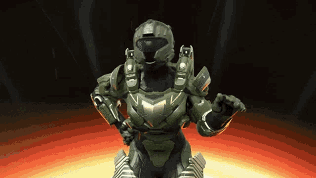 a video game character in a green armor is standing in a dark room
