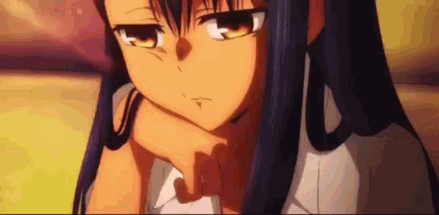 a close up of a person 's face with their hand on their face .