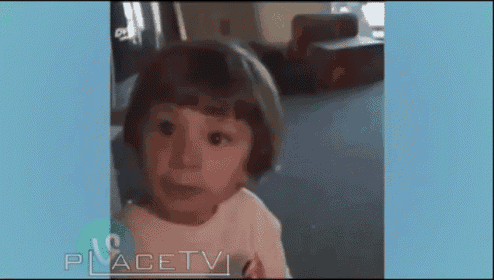 a little girl is looking at the camera with placetv written on the bottom