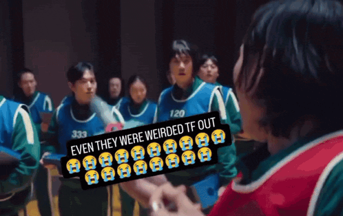 a group of people standing in a dark room with a sign that says even they were weirded tf out