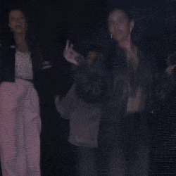 a man and a woman are dancing in the dark