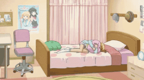 a girl is laying on a bed in a bedroom with a poster on the wall .