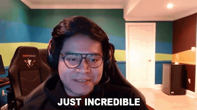 a man wearing glasses and headphones says just incredible in a video call