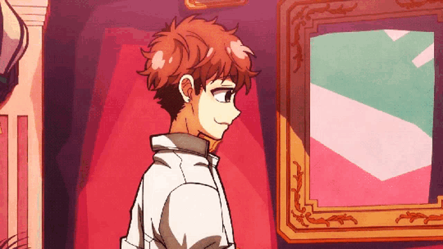 a boy in a white shirt is standing in front of a picture frame