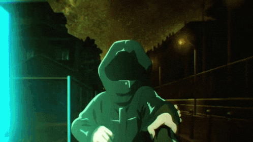 a person in a green hoodie with a cross on the front