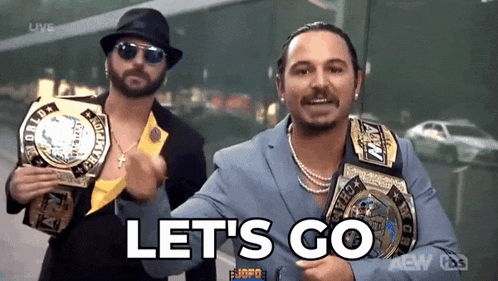 two wrestlers are holding championship belts and the words let 's go are on the screen .