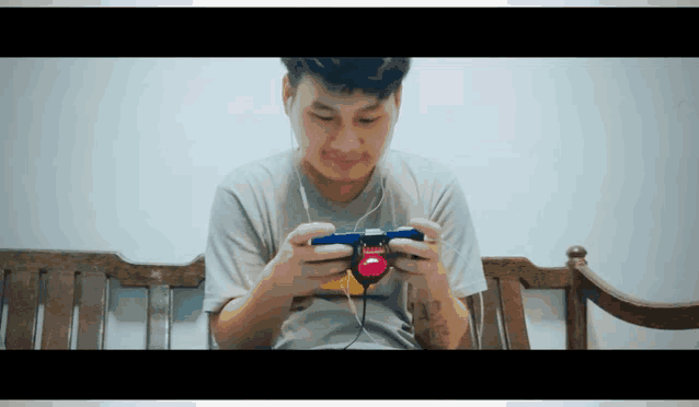a man with a tattoo on his arm playing a game