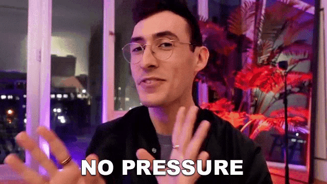 a man with glasses and a ring on his finger is saying no pressure