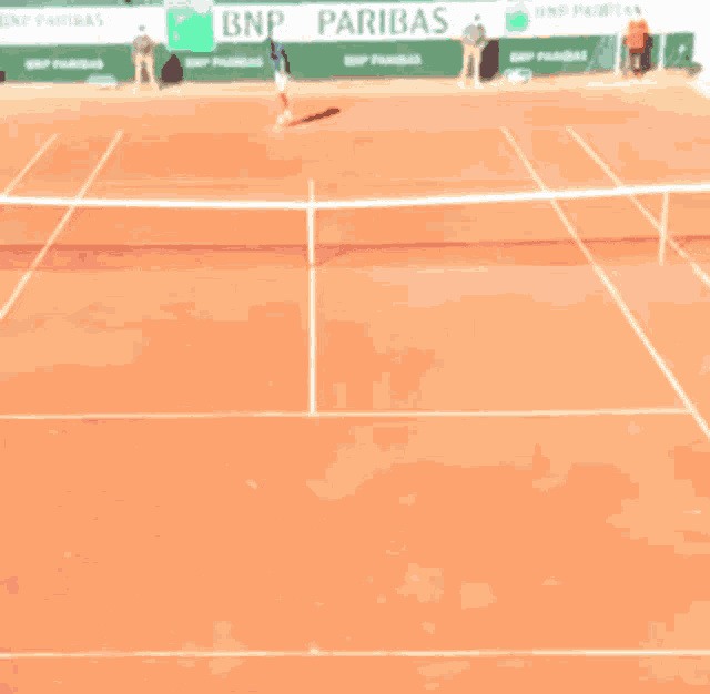 a tennis court with bnp paribas advertisements on the walls