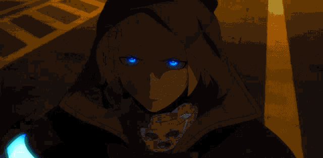 a woman 's face is visible in a blue light