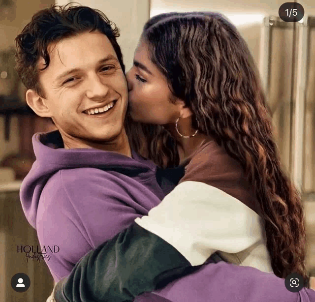 a woman kissing a man on the cheek with the number 1/5 on the bottom