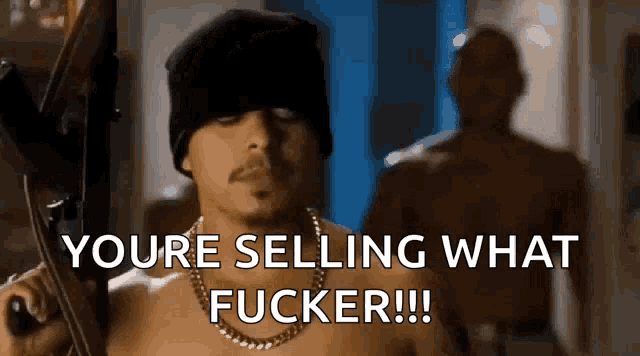a shirtless man is holding a gun and says you 're selling what fucker !!!