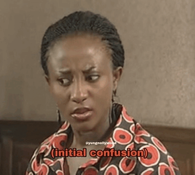 a woman in a colorful shirt is making a funny face and the words `` initial confusion '' are coming out of her mouth .