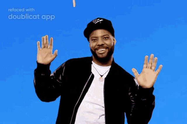 a man with a beard is standing in front of a blue background with confetti falling on him